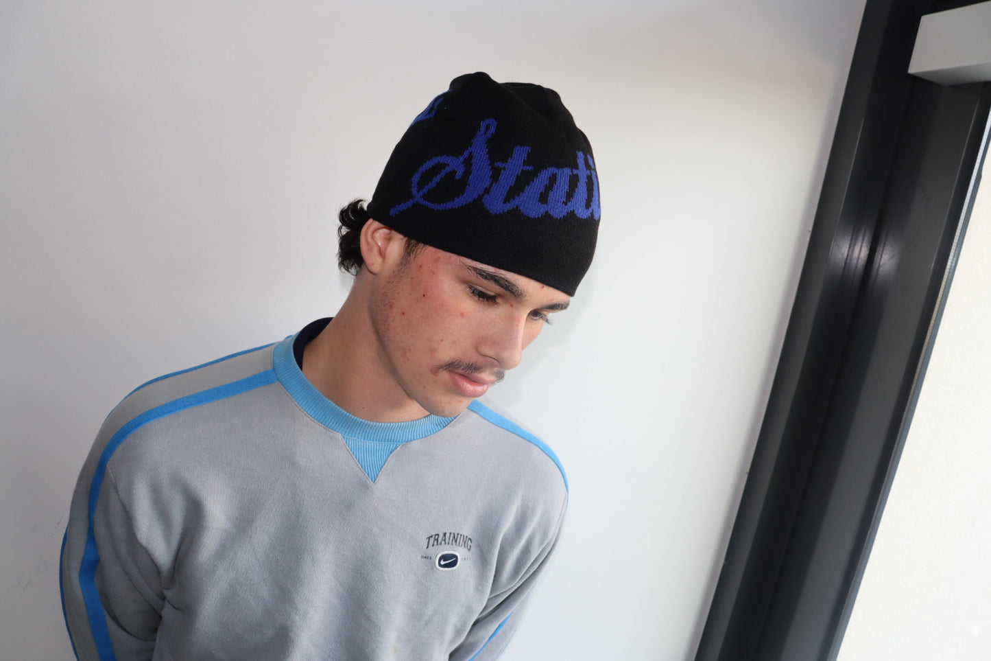 Black and blue reversible beanie
